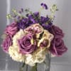 Hydrangeas and roses are the center of attention in this beautiful delicately