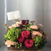 Hydrangeas, hot pink roses , carnations, and beautiful fillers , bring life