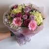 bouquets are never identical, but will have the same overall theme, wrapping