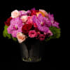 Bright and colorful assorment spray roses , red roses, ranunculus, vanda Orchids