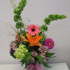 A beautiful vased arrangement of Asiatic lilies, Gerbera Daisies, Alstroemeria, Hydrangea and