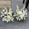 Medium size white flowers basket for funeral. Come in 2 arrangements.