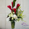 Experience a burst of vibrant colors with our exotic flower arrangement featuring