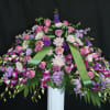 a large casket cover featuring a variety of flowers from traditional to