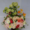This Beautiful bright arrangement consists of seasonal spring flowers such as vibrant