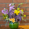 Exotic Vanda orchids. Fragrant stock, bright yellow ranunculus accented with solidago spray