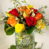 A Classic mix of pink, purple, yellow, and peach roses accented with