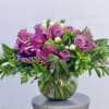 Sweet and simple arrangement of purple and lavender roses, green and white