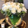 This modern arrangement uses white roses to beautifully showcase a levitating arrangement!