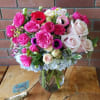 Absolutely gorgeous arragement with blue hydrangeas, pink anemones, roses, garden roses, spray