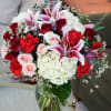 Classic beauty! Delicate red roses,hydrangeas, stargazer lilies,pink spray roses, tulips, ranunculus and
