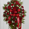 An all red standing spray meant for royalty. Send this festive bouquet