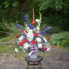 A traditional fresh arrangement of red white and blue. Commonly used for