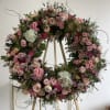 Express your deepest sympathies with those bright color wreath . Roses 
