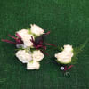 Wrist corsage and boutonniere in white and burgundy. CUSTOMER CAN CHOOSE ANY