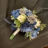 Silk or sola wood flowers in cream, blues, and gray. Boutonierre and