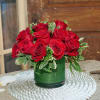 One dozen red roses arranged in  5x5 cylinder vase with assorted