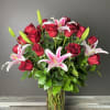 Includes 24 beautiful long stem red roses arranged in a clear glass