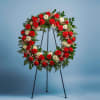 Condolences flower arrangement. All real flowers. Some flowers may vary due to