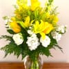 Tall decorative glass vase arrangement composed of Snapdragons, Lilies, Roses, Lisianthus, &amp;