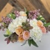 Our Seasonal bright arrangement is bright and fun. We hand select our