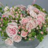 This gorgeous design will make anyone gush. Pink roses, pink hypericum berries