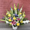 A meadow of flowers, this fan-shaped design is bursting with yellow roses