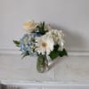 Beautiful blue and white hydrangea, off white rose and white gerbera daisy