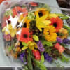 A LARGE MIXED PREMIUM ARM BOUQUET OF FRESH FLOWERS IN A FALL