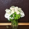 A mix of white roses, hydrangea, orchids and other seasonal white flowers