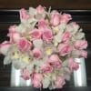 Low full design of 2 doz soft pink roses and white orchids
3