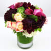 Arrangement with roses, calla lilies and more!