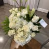Funeral arrangement, made with hydrangeas, roses, spray roses, lilies, Chrysanthemums and greenery