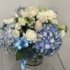 Welcoming a new baby is such a special day! This arrangement is