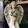 Gorgeous resin angel holding a bunch of flowers. 12.5&quot; tall