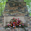 Rich orange, peach and burgundy colors roses, spray roses, peonies, daises and