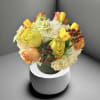A bright cheerful mix of hydrangea, colorful roses, and seasonal flowers and
