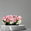 Pink Roses and Hydrangeas in a low rectangular vase.