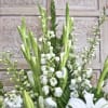 this luminous gladious arrangement pays tribute to your loved one.