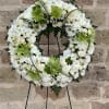 Fragrant and ethereal white blossoms set among a ring of greens form