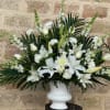 As serene as gently falling snow, this elegant white arrangement in a