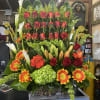 Gorgeous tropical color arrangement with 3 line of orange roses and combined