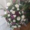 Beautiful white and burgundy/purple standing spray of white roses and carnations, burgundy