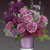 Shimmering with the beauty of a faceted amethyst, this luxurious rose bouquet