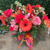 Gerbera daisies with roses and lisianthus.