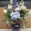 designed in a blue vase (may vary ) with white and blue