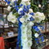 Lovely display with roses lilies blue delphinium. 