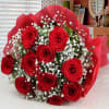 1 Dozen medium roses beautifully wrapped with filler and greenery presentation style.
