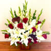 This elegant floor basket design includes Roses, Lilies, Stock, Snapdragon, Gladiola, and