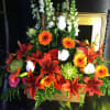 colorful mix of roses, gerbera daisies. lilies, and snapdragons